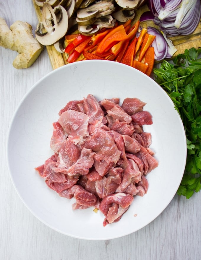 A bowl showing the cut of lamb sliced for stir fry