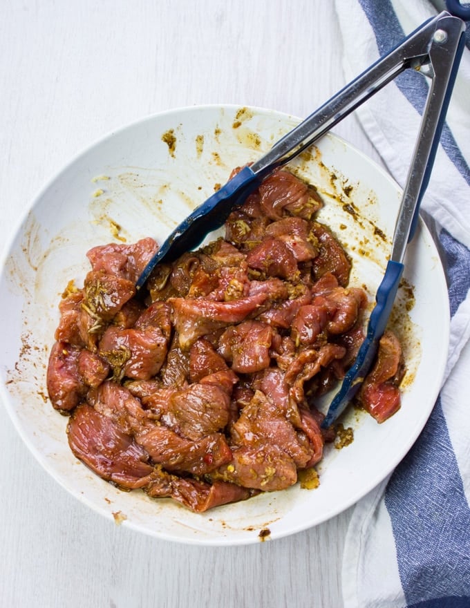 A bowl with the lamb marinating