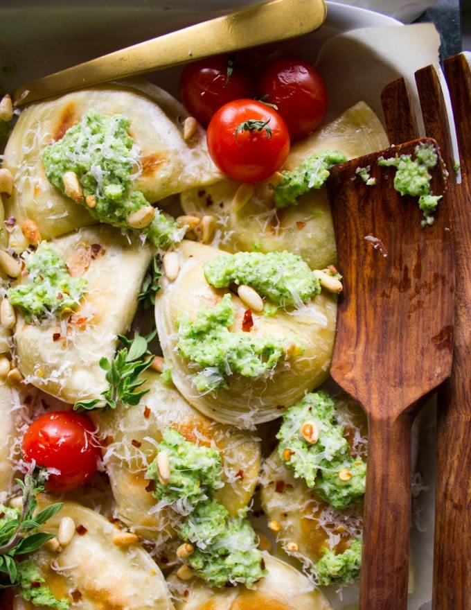 Close up of the pirogies with a dollop of broccoli pesto