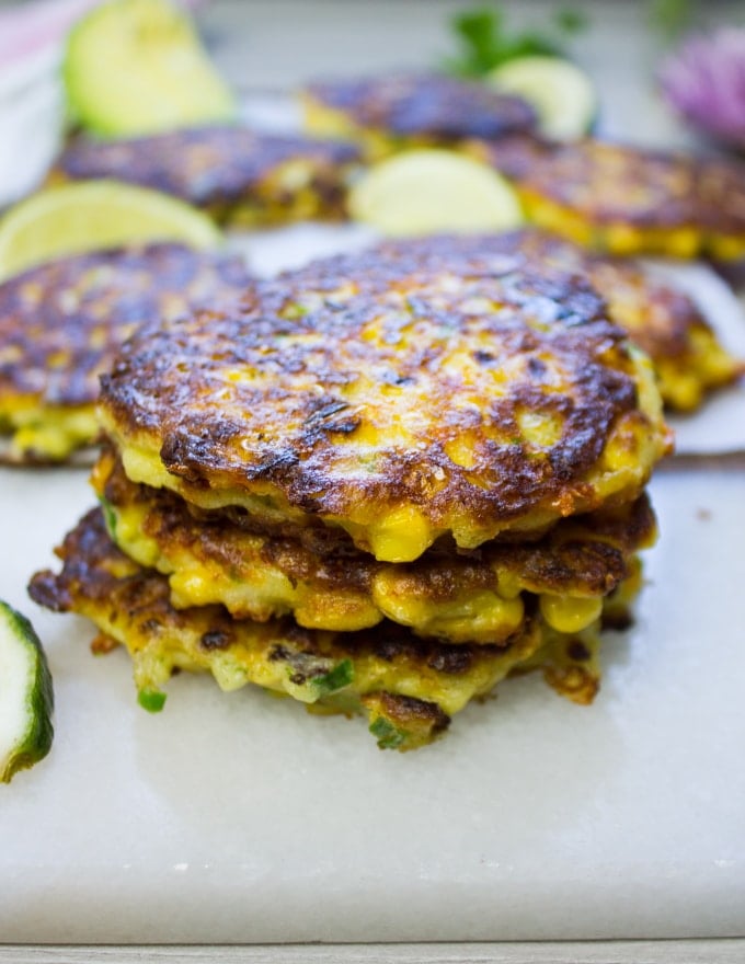 Stack of three corn fritters out of the pan