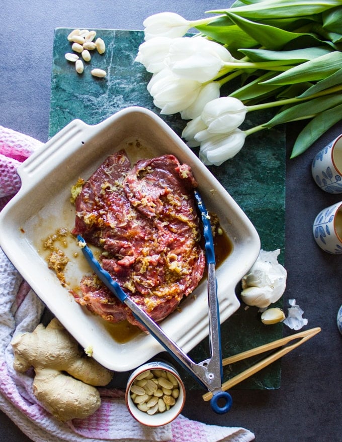 lamb in a plate marinated and ready for grilling