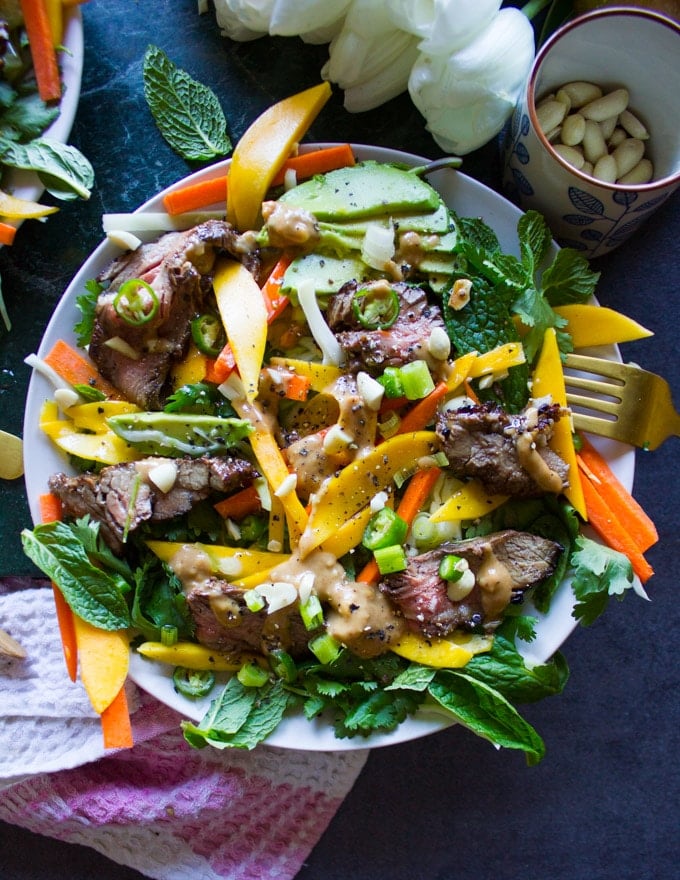 One Thai salad plate all dressed up with peanut dressing and a fork