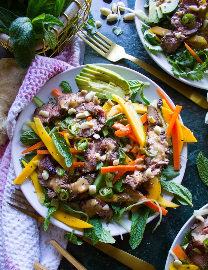 A big plate of Thai Salad and Peanut Dressing surrounded by a towel