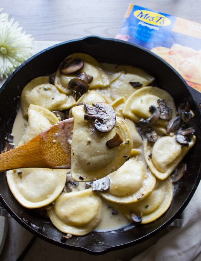 Cooked Pierogies ready with the alfredo sauce