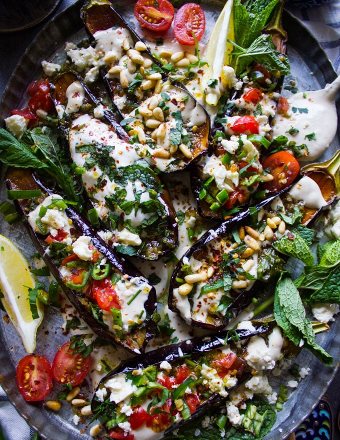 A collection of fried eggplants with different toppings for the eggplant salad