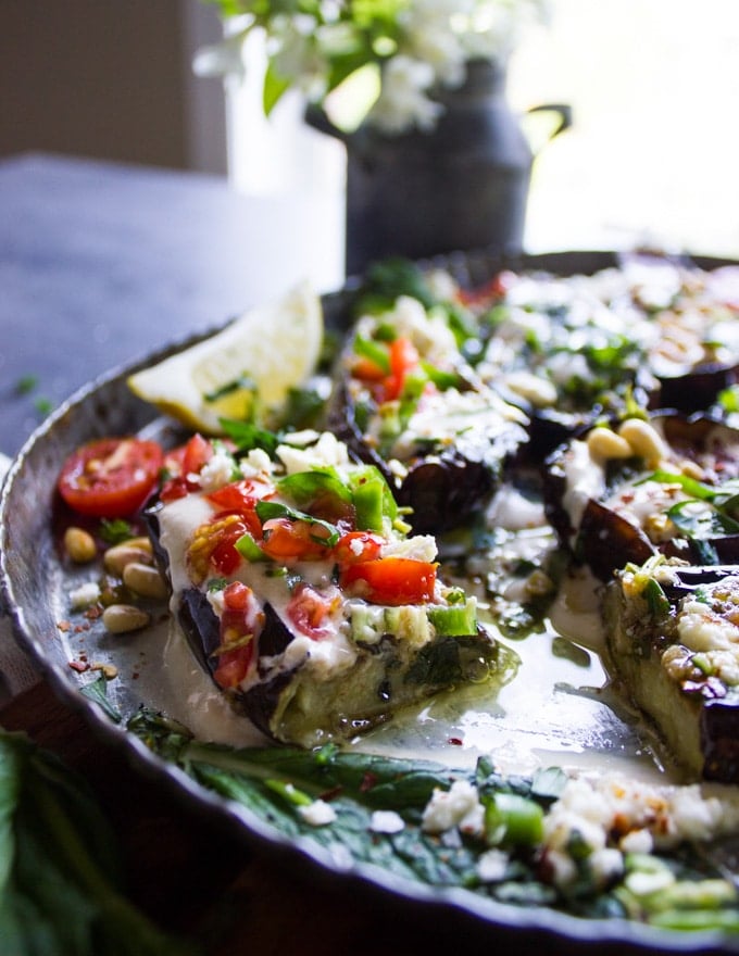 A fried eggplant cut in half to show the inside of how creamy and soft it is