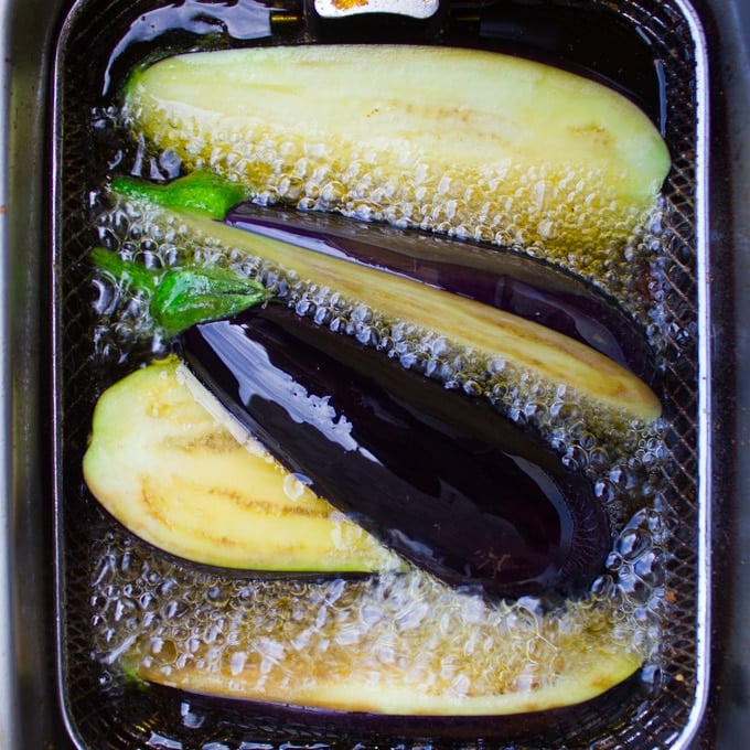 eggplants frying in hot oil