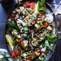 Close up of the eggplant salad plate showing a variety of toppings on the fried eggplants