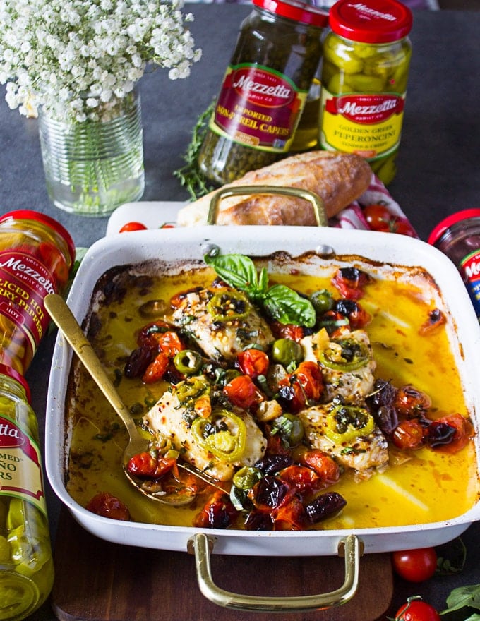 The baked fish recipe ready and a spoon used to serve it