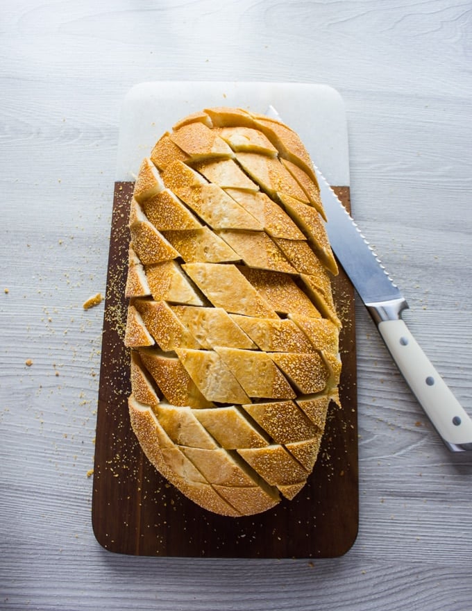 A whole loaf of bread sliced diagonally