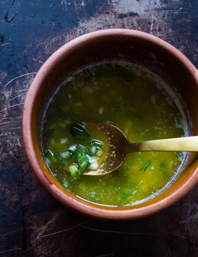 Bowl of butter mixed with garlic, salt and jalapenos