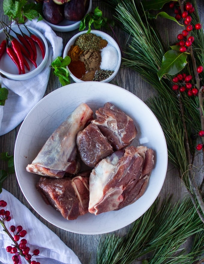 A bowl of American lamb shoulder cut up and trimmed of the fat ready to cook 