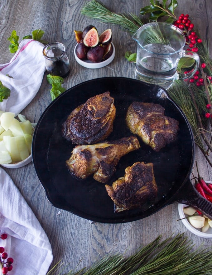 seared lamb meat on a skillet ready for the sauec