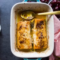 Baked mahi mahi right out of the oven with melted butter around it ready to serve