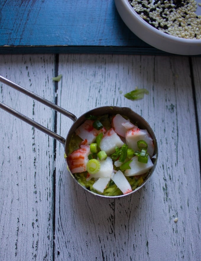 imitation crab meat and scallions are now added in the same measuring cup for the crab sushi or california rolls