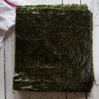 A stack of seaweed sheets to roll the sushi burrito