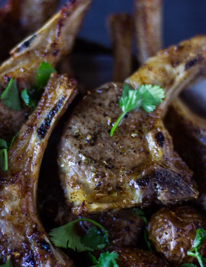 Close up of one lamb chops showing the crisp texture and how well cooked it is