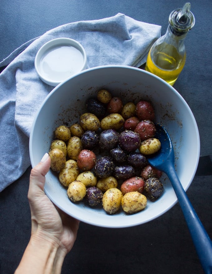 Seasoned potatoes in a bowl ready to air fry