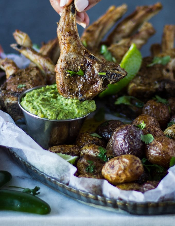 A crispy Air Fryer Lamb Chops Dipped in Poblano Sauce showing the crisp and sauce