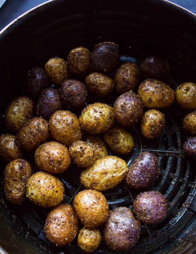 Crispy air fryer potatoes ready and cooked perfectly in the air fryer basket