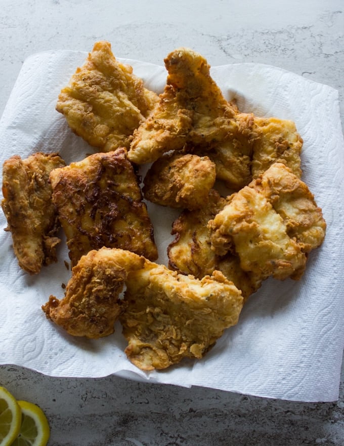 Fish fried and drying on paper towels ready to be served