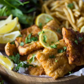 A pile of fish fry and lemon slices