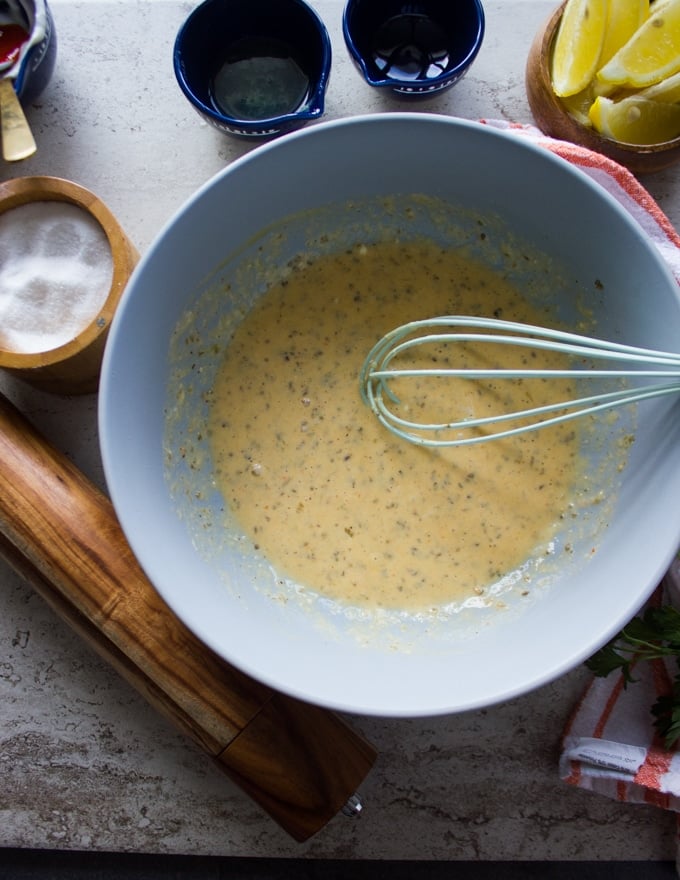 Wet mixture for coating the fish is ready in a bowl 