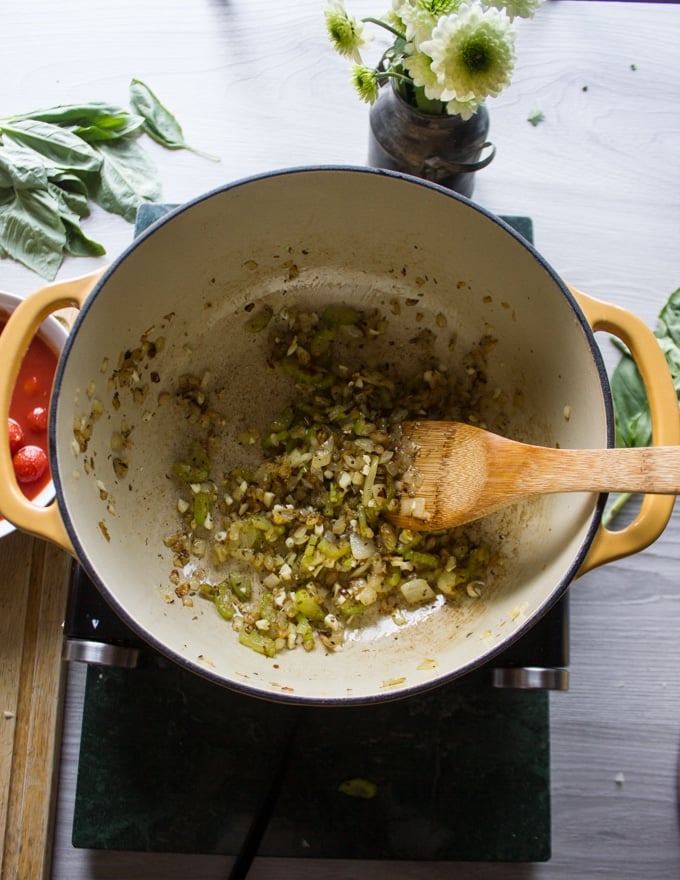 A large pot with sauteed onions, celery and garlic