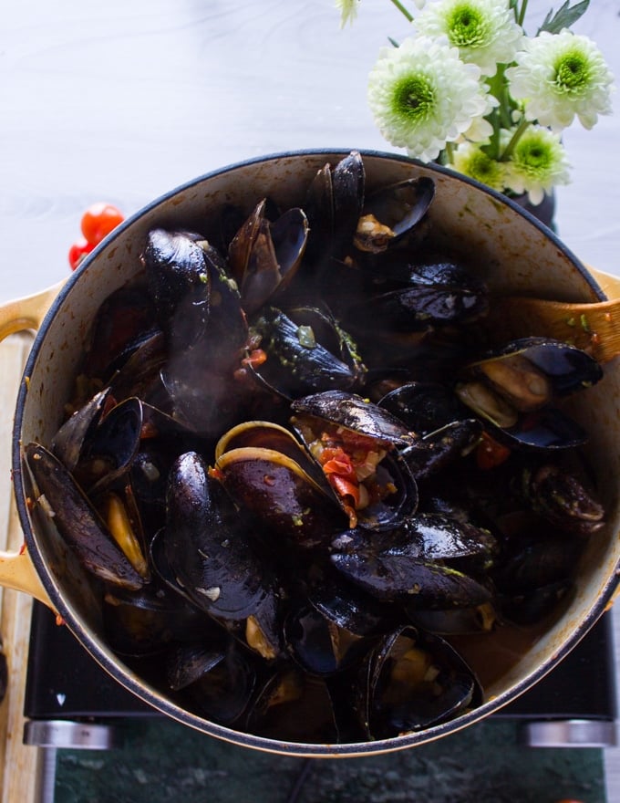 Mussels added into the pot with marinara sauce