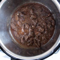 Finished and ready beef tips recipe on the instant pot and stove top ready to serve with rice