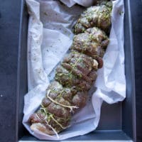 stuffed and ready boneless leg of lamb going in the oven