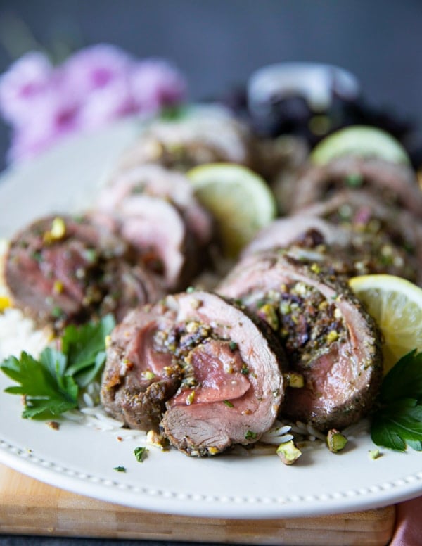 Close up sliced boneless leg of lamb recipe showing the cooked lamb and the stuffing