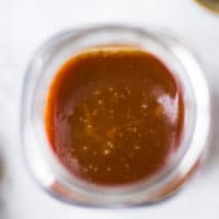 finished caramel sauce in a glass jar