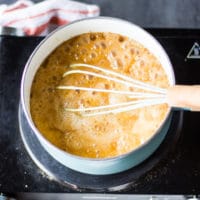 golden sugar with added butter and cream in a pot to finish off the caramel sauce recipe