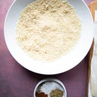 Panko bread crumbs in a bowl and another small bowl of spices ready to flavor the breadcrumbs