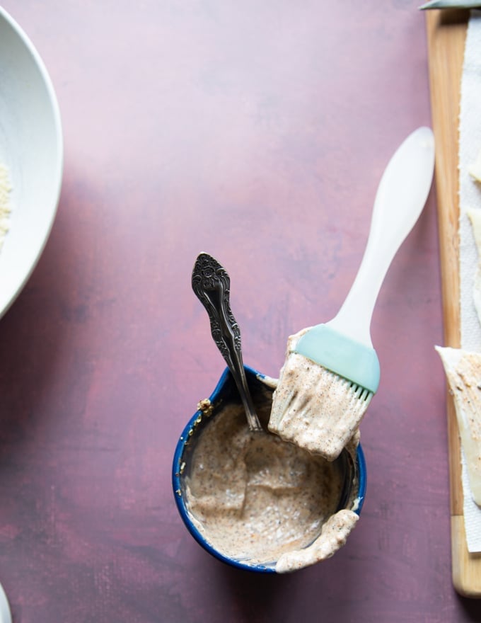 Fish Coating Mixture with a pastry brush.