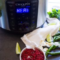 An instant pot or crock-pot turned on to cook the potatoes faster