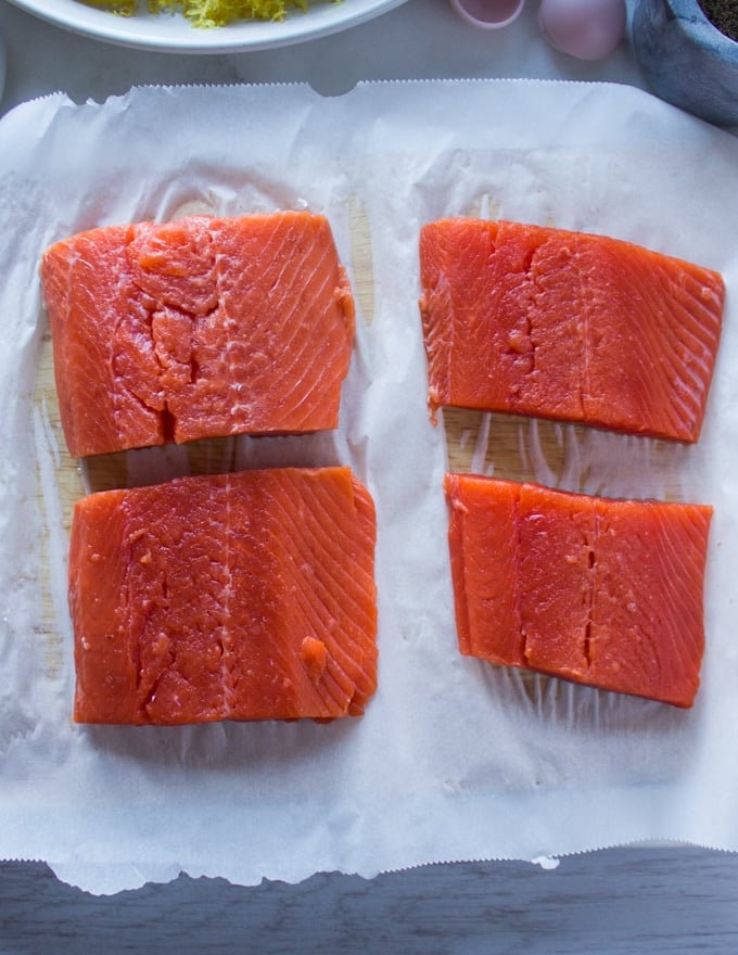 sockeye salmon fillets on a parchment paper