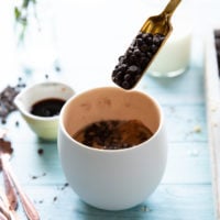 A spoonful of chocolate chips added to the batter to finish off the brownie in a mug ingredients