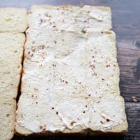 sliders bread cut in half and spread generously with mayonnaise and seasoned with salt pepper and chilli flakes