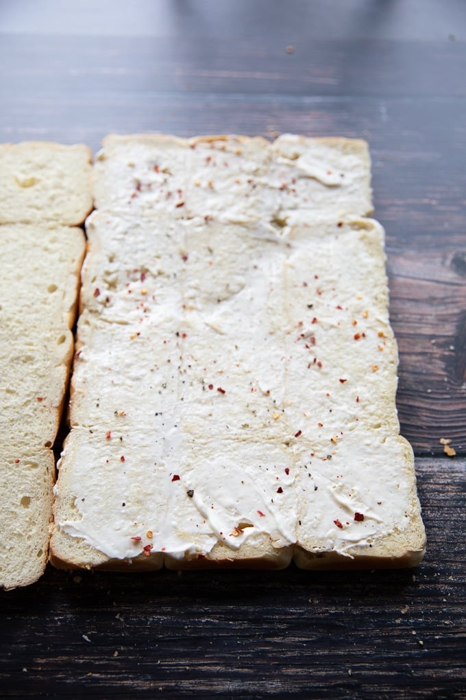 sliders bread cut in half and spread generously with mayonnaise and seasoned with salt pepper and chilli flakes