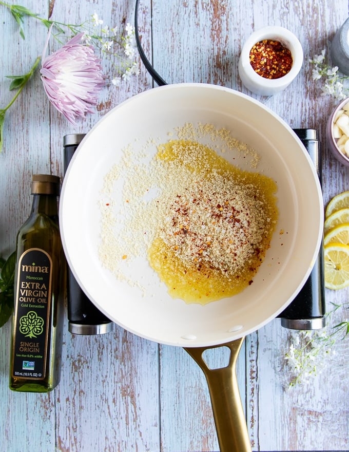 bread crumbs in a skillet with some olive ready to toast