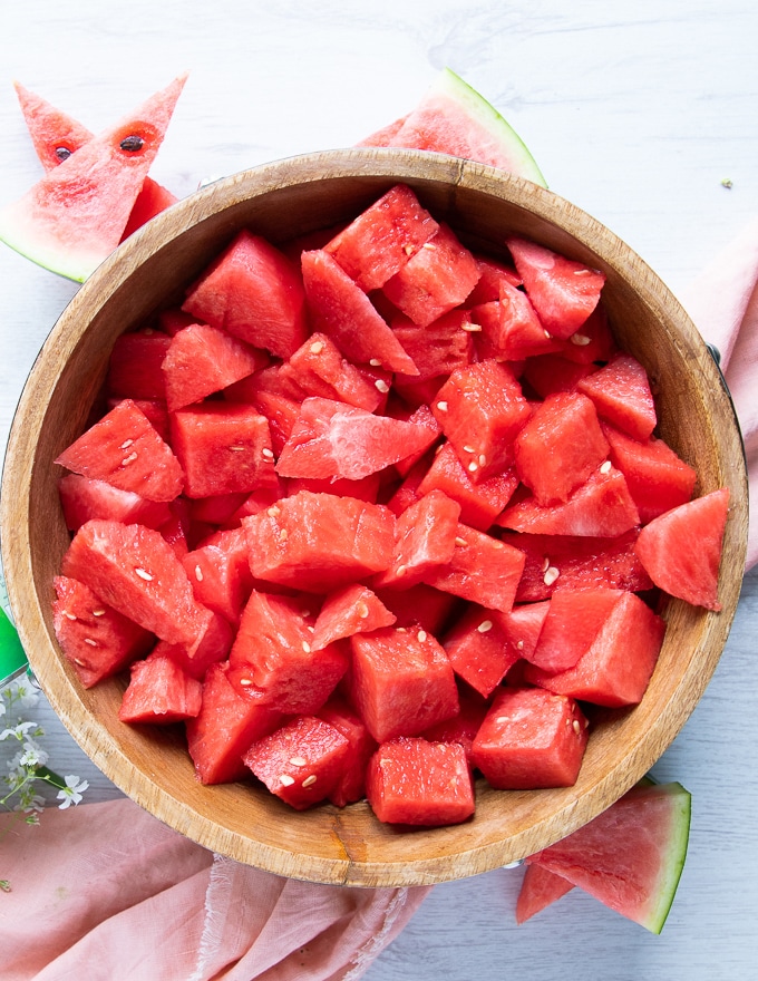 watermelon cut up into 1 inch cubes in a large bowl