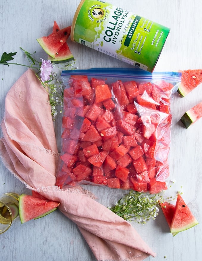 a large freezer bag filled with the watermelon and sealed is ready for the freezer