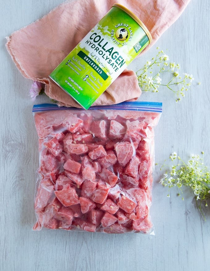 fully frozen watermelon chunks in a ziploc bag