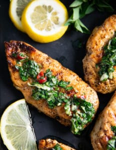 close up of one chicken drizzled with chimichurri recipe