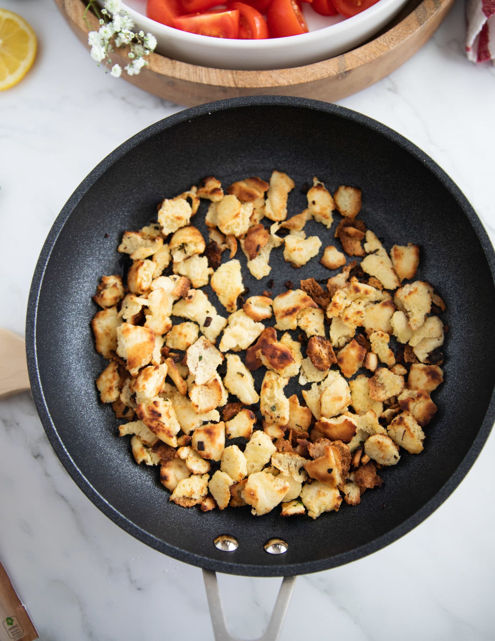golden toasted bread chunks in the skillet ready