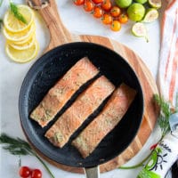 salmon fillets marinated and placed in a stove top grill pan