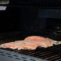 marinated salmon fillets on a BBQ grill