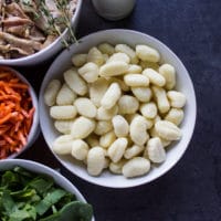 a bowl of potato gnocchi and spinach